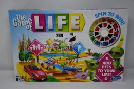 Ten boxed as new The Game of Life board games.
