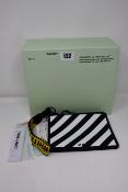 An as new Off White Diag clutch bag with 