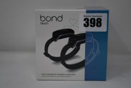 A pair of boxed as new Bond Touch smart bracelets (Bond002).