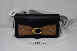 An as new Coach B4 bag in tan/black.