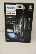 One as new Philips Sonicare Diamondclean smart sonic electric toothbrush.