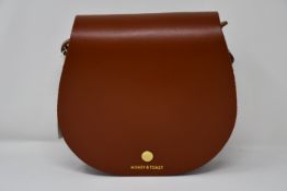 An as new Honey & Toast Etter leather saddlebag handbag in navy and sun yellow (RRP £120).
