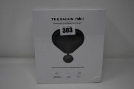 One Theragun Mini ultra portable massage gun.