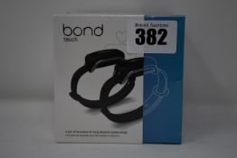 A pair of boxed as new Bond Touch smart bracelets (Bond002).