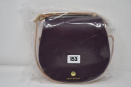 An as new Honey & Toast Etter leather saddlebag handbag in dark red, pink and nude (RRP £120).