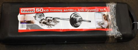 A boxed as new York 50kg black chrome barbell and dumbbell set.
