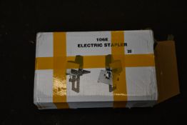 A 106E electric stapler (Box unsealed and damaged).