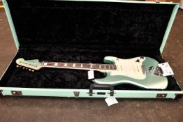 A Fender Parallel Universe 2 Strat guitar and hard case (Bit of damage to front of case).