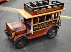 A wooden and metal vintage toy advertising truck. Advertising Irish Whisky and biscuits, 66cm x