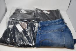 Four pairs of as new G-Star Raw jeans.