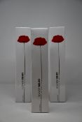 Three bottles of Flower by Kenzo eau de parfums (3 x 100ml).