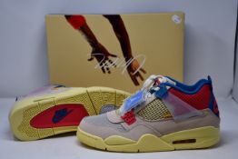 A pair of as new Nike Air Jordan 4 Retro SP trainers in guava ice/fusion red (UK 9.5).