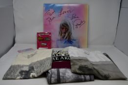 A signed vinyl copy of Taylor Swift Lover (Dedicated to Mae) together with four Taylor Swift T-