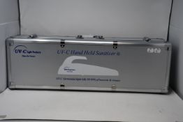 An as new UV - C hand held sanitizer (Powerful 24W) contained in a metal carry case.