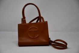 An as new Telfar Small Shopper in brown (RRP €133).