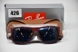 A pair of as new Ray Ban sunglasses.