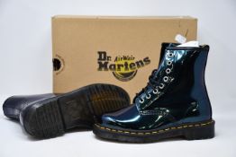 A pair of as new Dr Martens 1460 boots in teal (UK 4).