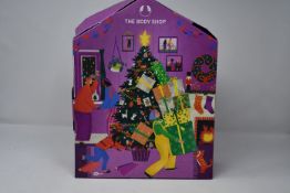 Two boxed as new The Body Shop, Make It Real Together advent calendars.