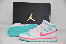 A pair of as new Nike Air Jordan 1 Mid trainers (UK 3.5).