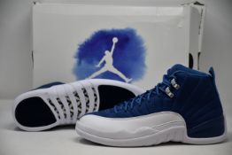 A pair of as new Nike Air Jordan 12 Retro (UK 8.5).