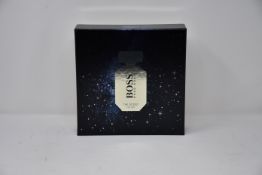 Three boxed as new Hugo Boss The Scent for Her parfum and body wash gift sets.