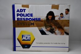A boxed as new ADT outer security - CCTV, s/n 3019404829 (Cosmetic damage to outer box).