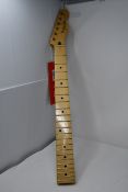 One as new Fender Telecaster neck.