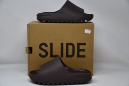 A pair of as new Adidas Yeezy Slide (UK 6).