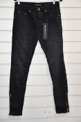 A pair of as new The Kooples blue destroyed denim jeans (30 - RRP €168).