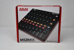 One Akai Midimix Compact High-Performance Mixer/Daw Controller, one Swissonic Studio Monitor MM-3 (1