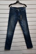 A pair of as new The Kooples Blue Destroyed jeans (28 - RRP £165).