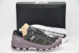 A pair of as new On Running Cloudenture running shoes (UK 5.5).