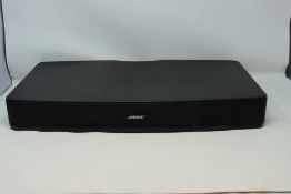 A pre-owned Bose Solo TV Sound System with Remote and power cable (Powered on but not tested