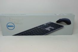 A boxed as new Dell KM7120W Multi-Device Wireless Keyboard and Mouse (Box sealed, damage to box).