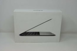 A pre-owned Apple MacBook Pro (13