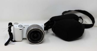 A pre-owned Sony Alpha NEX-5R Mirrorless Digital Camera in White with a Sony SELP1650 16-50mm