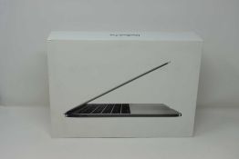 A pre-owned Apple MacBook Pro (13