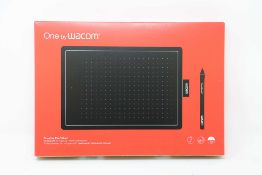 A boxed as new Wacom One Medium Graphics Tablet and Pen in Black & Red (Box sealed).