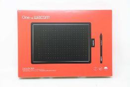 A boxed as new Wacom One Medium Graphics Tablet and Pen in Black & Red (Box sealed).