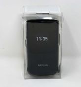 A boxed as new Nokia 2720 Flip TA-1173 SS 4G LTE in Black (Box sealed, some damage to packaging).