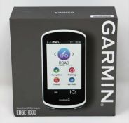 A boxed as new Garmin Edge 1030 GPS Cycling Computer (Box sealed, some cosmetic damage to box).