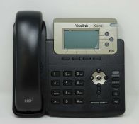 A boxed as new Yealink SIP-T23G Enterprise IP Phone in Black (Box opened, packaging states '