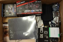 A box of assorted as new small electrical items and accessories.