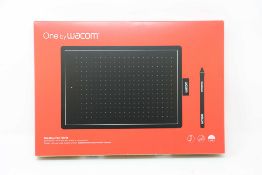 A boxed as new Wacom One Medium Graphics Tablet and Pen in Black & Red (Box sealed).