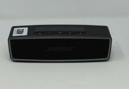 A pre-owned Bose Soundlink Mini Bluetooth Speaker (Speaker only, no accessories included).