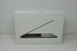 A pre-owned Apple MacBook Pro (13