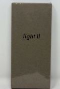 A boxed as new Light Phone II TLP202 in Grey (Checkmend report ID: CM16682336-9375D) (Box sealed)