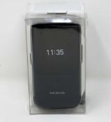 A boxed as new Nokia 2720 Flip TA-1173 SS 4G LTE in Black (Box sealed, some damage to packaging).