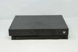 A pre-owned Xbox One X in Black (Model No: 1787) (no power supply, controllers or other accessories)