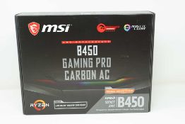 A pre-owned MSI B450 Gaming Pro Carbon AC AM4 ATX Motherboard (P/N: 911-7B85-005) (Boxed) (Untested,